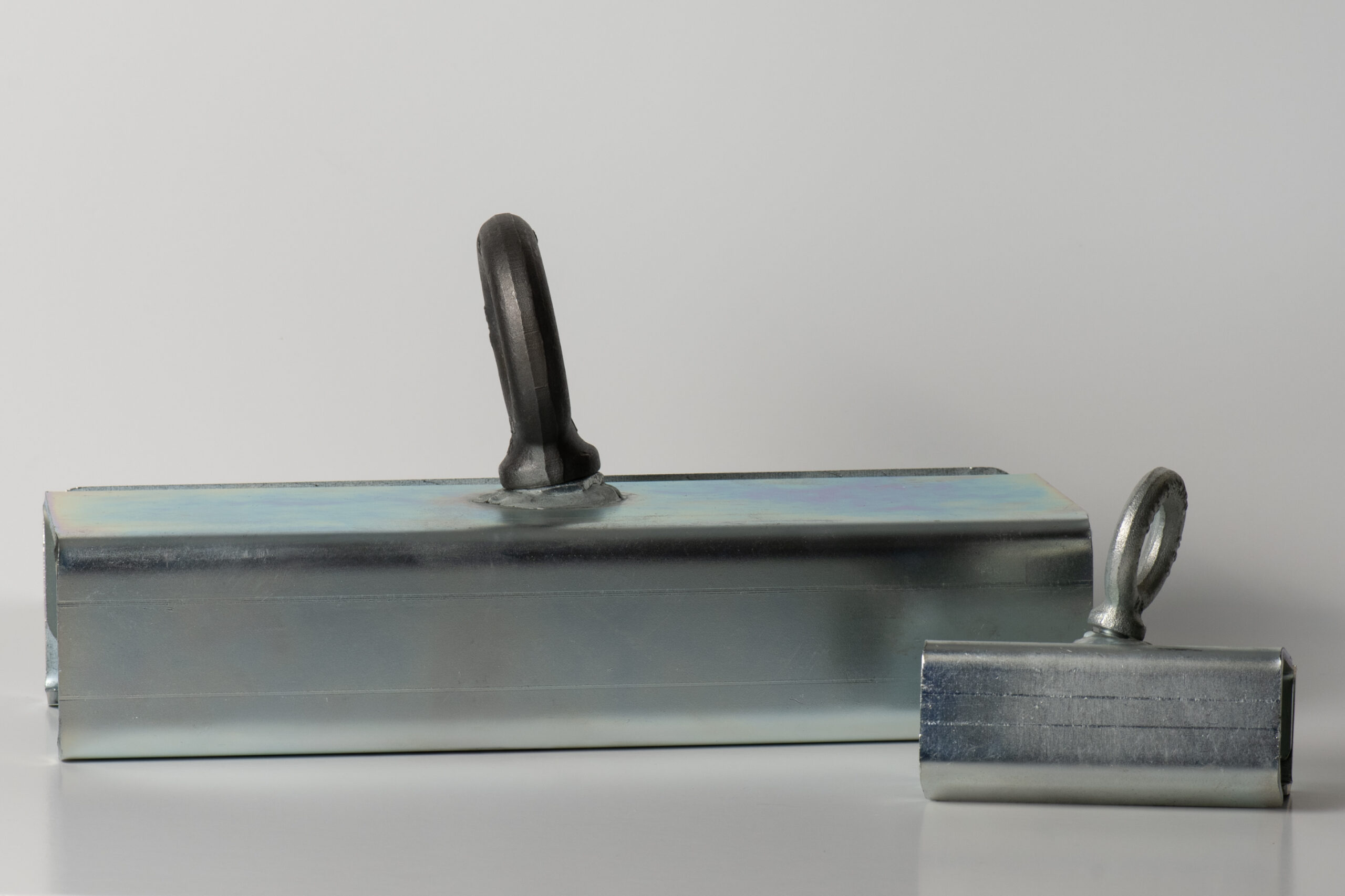 Large: rail clamps to beams up to 4.75" wide. Mini Rail Clamps to beams up to 2" wide.